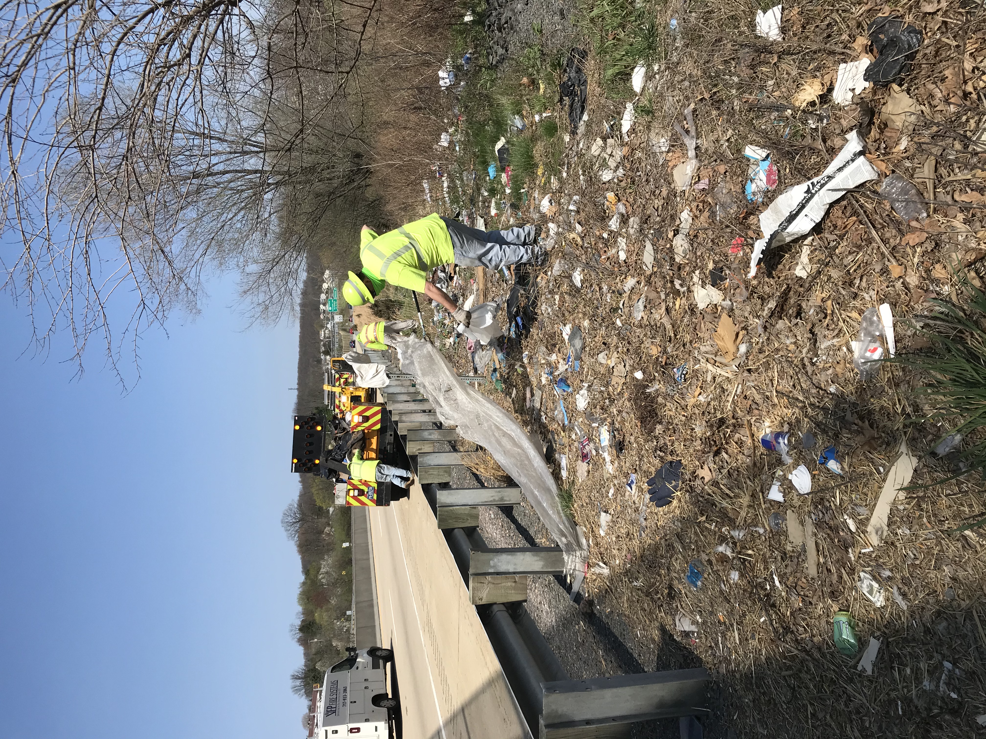 Road crew cleaning up litter