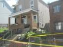 thumbnail of house with porch column collapse and brick crack