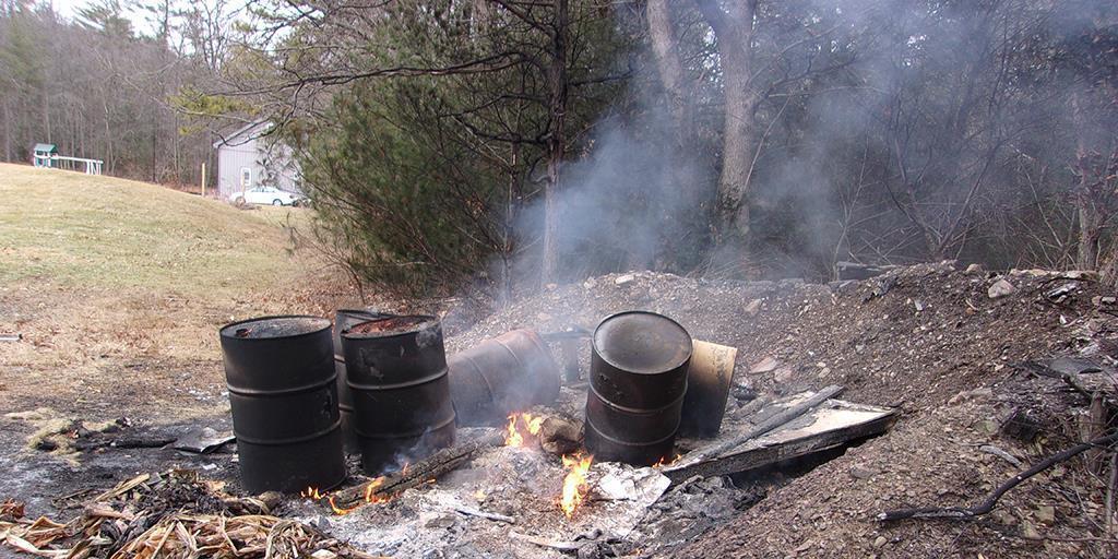 A Burn Bin That Has Been Used To Burn Wood, Paper And Other