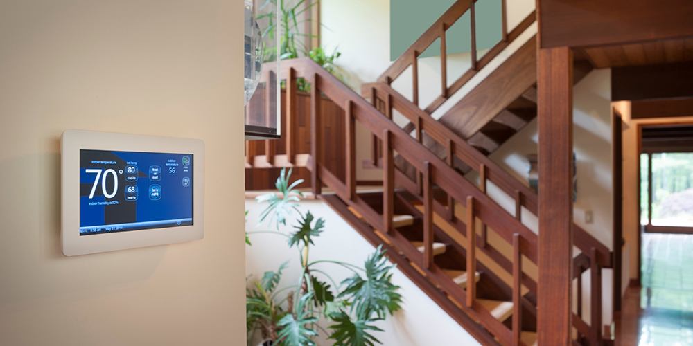 Smart wall energy control thermostat inside a home.