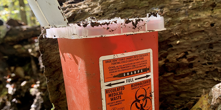 A medical waste container found at the dump site