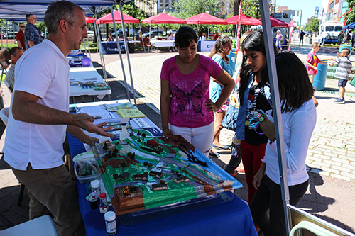 People learn about storm water at their local farmer's market